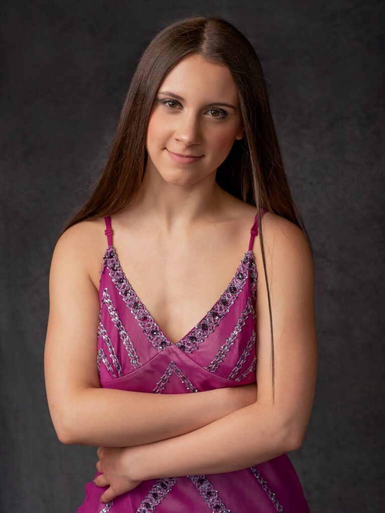 girl wearing a pink gown beauty pose