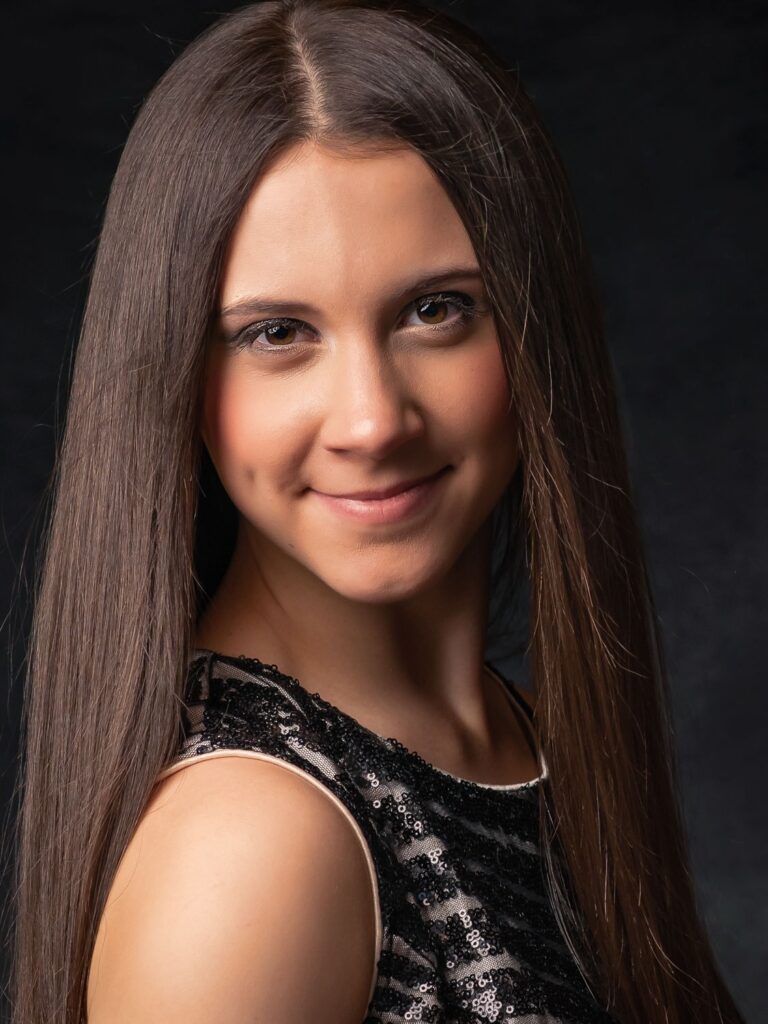 senior girl in a black elegant gown closeup photo
