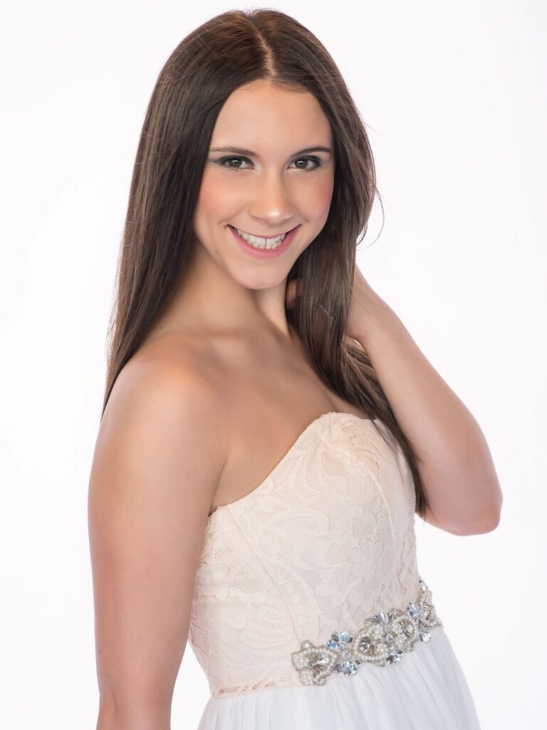 girl smiling in a homecoming dress